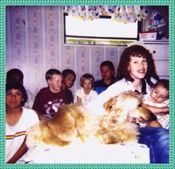 The Toohey family with Davey, a certified Therapy and Service Afghan Hound dog - AKC registered, family has handicapped and autistic children PHOTO