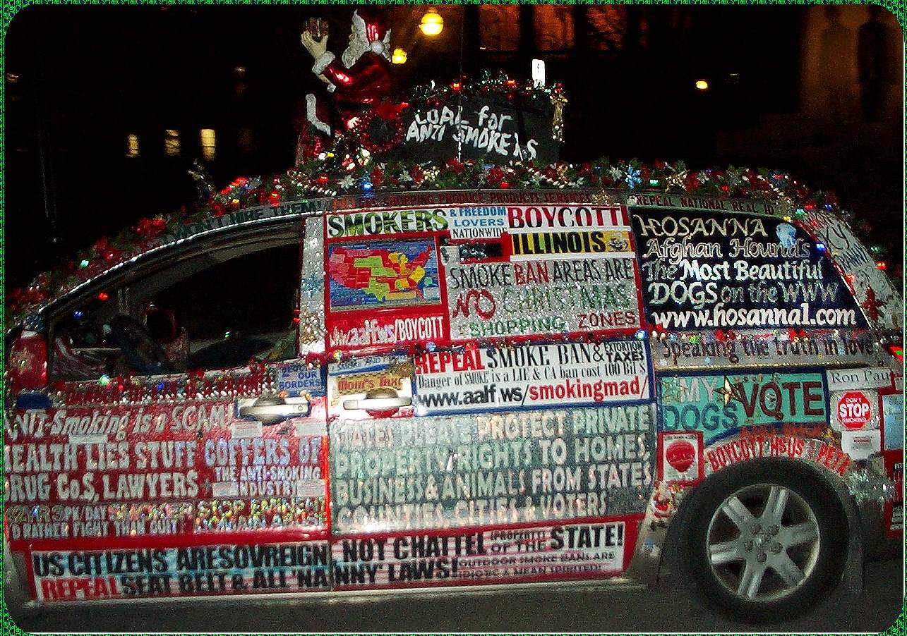 driver side picture of liberty van at night with Christmas lights and decorations, at smoking ban Illinois state capitol, Springfield